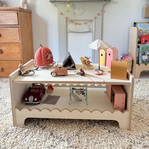 Child exploring wooden Montessori materials on a natural timber table in a bright Australian play room