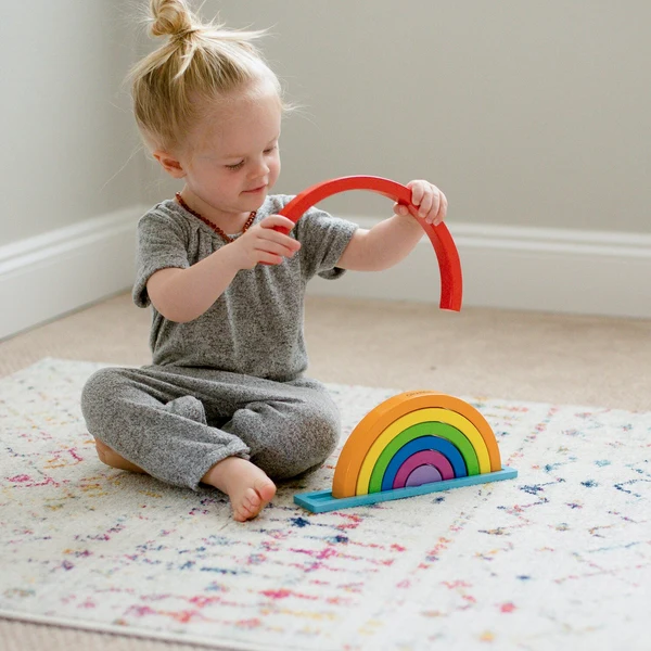 Toddler playing with age-appropriate Montessori-style toys