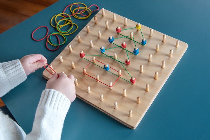 Child hands using a toy for fine motor practice